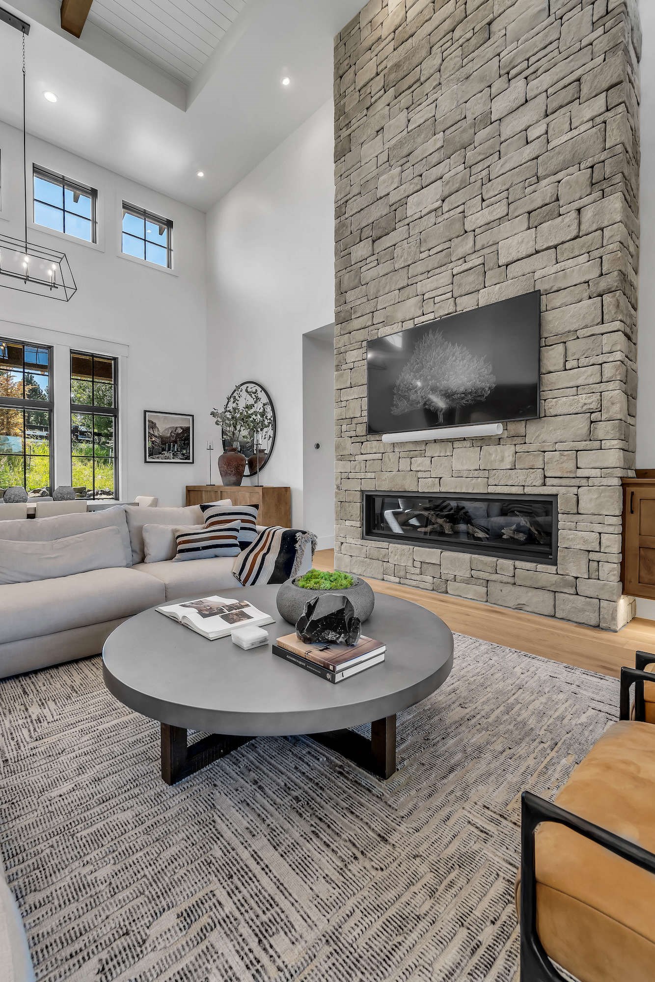 Cultured Stone Sculpted Ashlar Silver Shore warm gray thin stone on interior living room fireplace