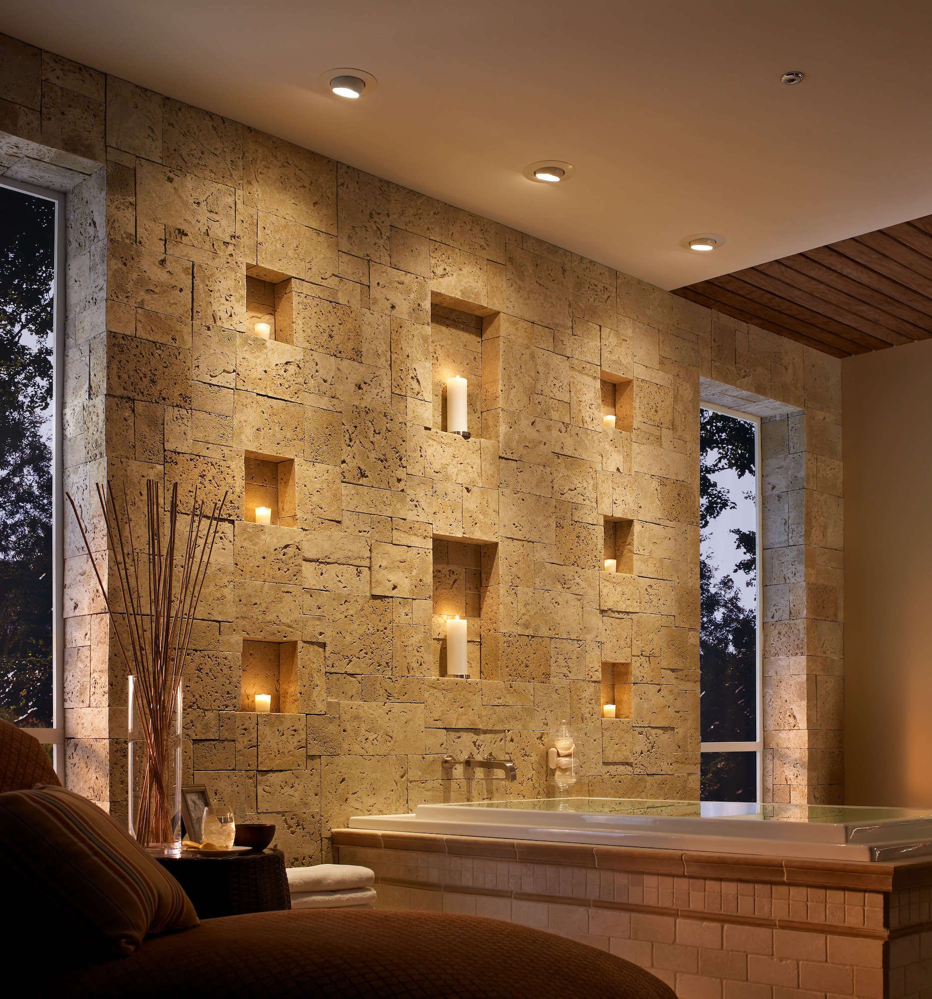 Eldorado Stone Coastal Reef Sanibel warm cream thin stone on interior bathroom wall with decorative built in candle shelving