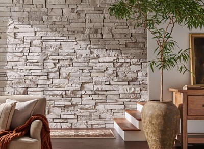 Cultured Stone Wheaton Country Ledgestone warm gray to cream thin stone on interior wall