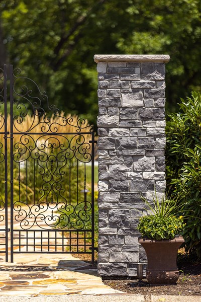 Glen-Gery | Glen Ridge Granite column with a decorative rod-iron gate