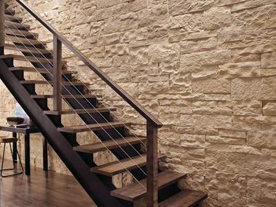 Eldorado Stone Cut Coarse Oyster warm white thin stone on interior wall with stairs