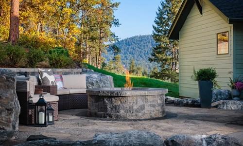 image of stone fire pit backyard among mountains