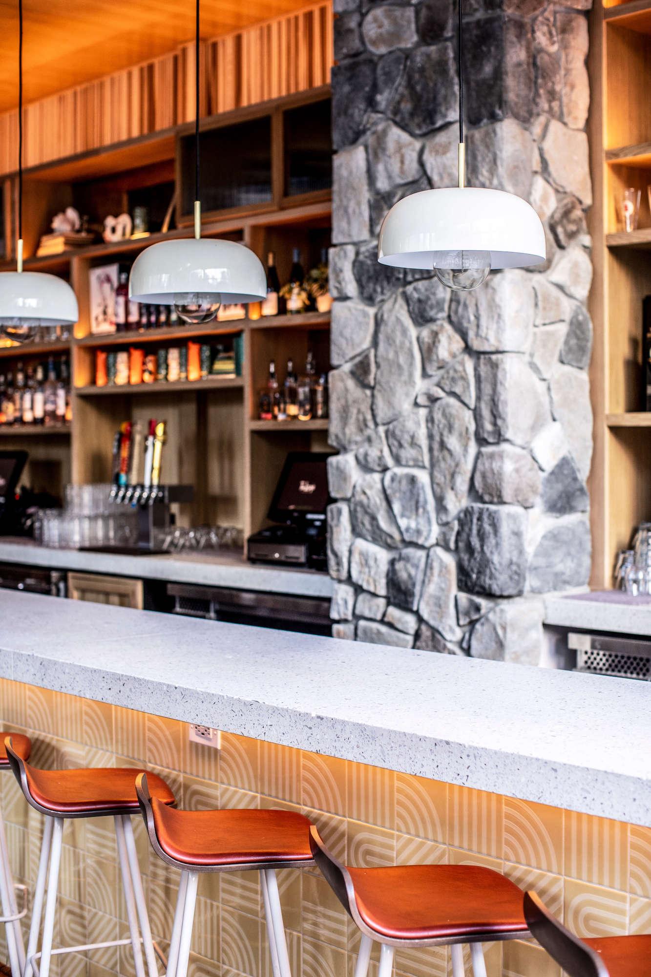 Cultured Stone Echo Ridge Dressed Fieldstone gray thin stone on interior wall column with full bar